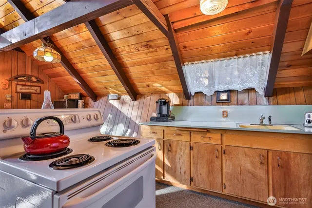 a kitchen with stainless steel appliances a refrigerator and a stove