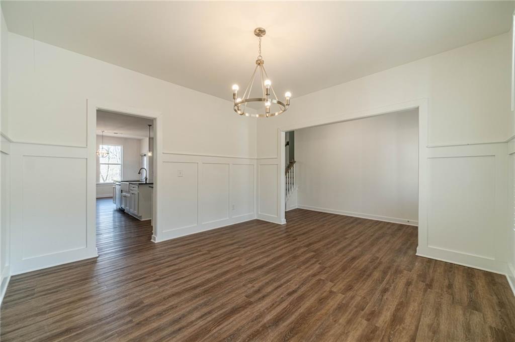 1548 Ridgewood Court Monroe, GA 30656 - Photo 14 of 63 wooden floor in an empty room with a window