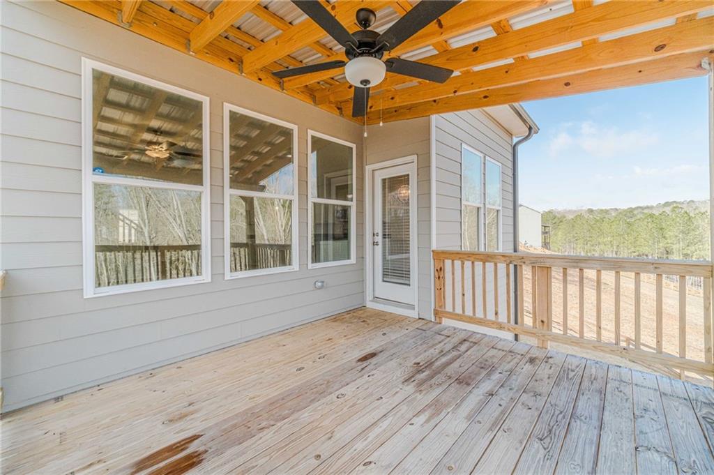 1548 Ridgewood Court Monroe, GA 30656 - Photo 21 of 63 a view of an empty room with wooden floor and a window