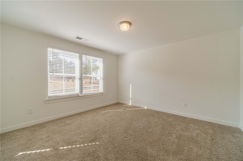 1548 Ridgewood Court Monroe, GA 30656 - Photo 23 of 59 an empty room with a window