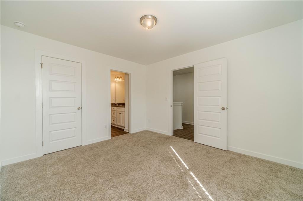 1548 Ridgewood Court Monroe, GA 30656 - Photo 27 of 59 an empty room with closet