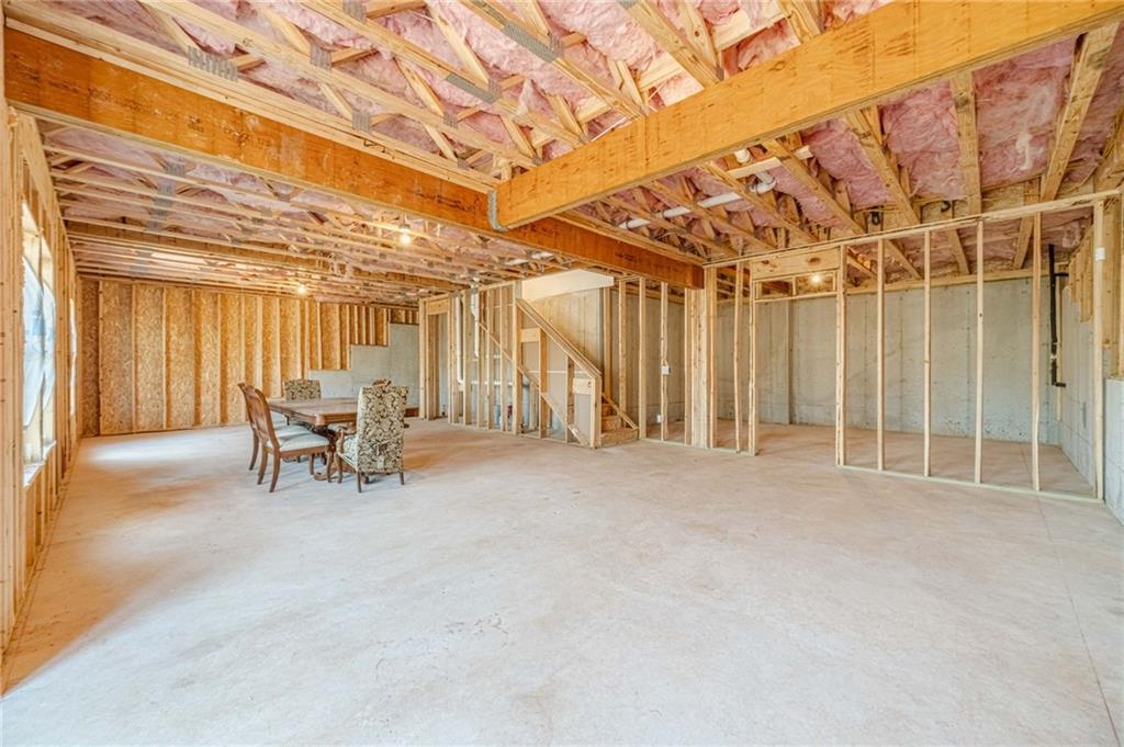 1548 Ridgewood Court Monroe, GA 30656 - Photo 38 of 59 a view of a room with furniture and a garage