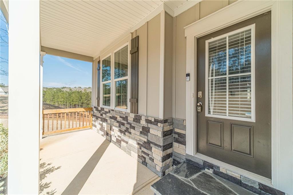 1548 Ridgewood Court Monroe, GA 30656 - Photo 40 of 59 a view of a chair and table in the porch