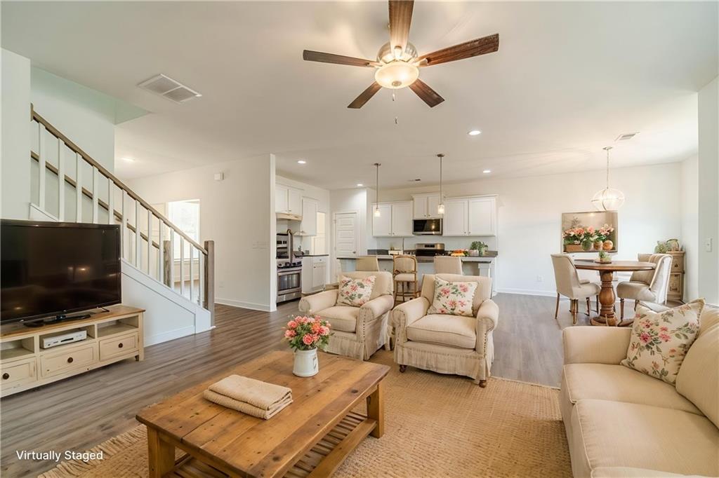 1548 Ridgewood Court Monroe, GA 30656 - Photo 4 of 63 a living room with furniture and a flat screen tv