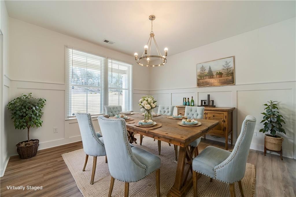 1548 Ridgewood Court Monroe, GA 30656 - Photo 5 of 63 a view of a dining room with furniture window and wooden floor