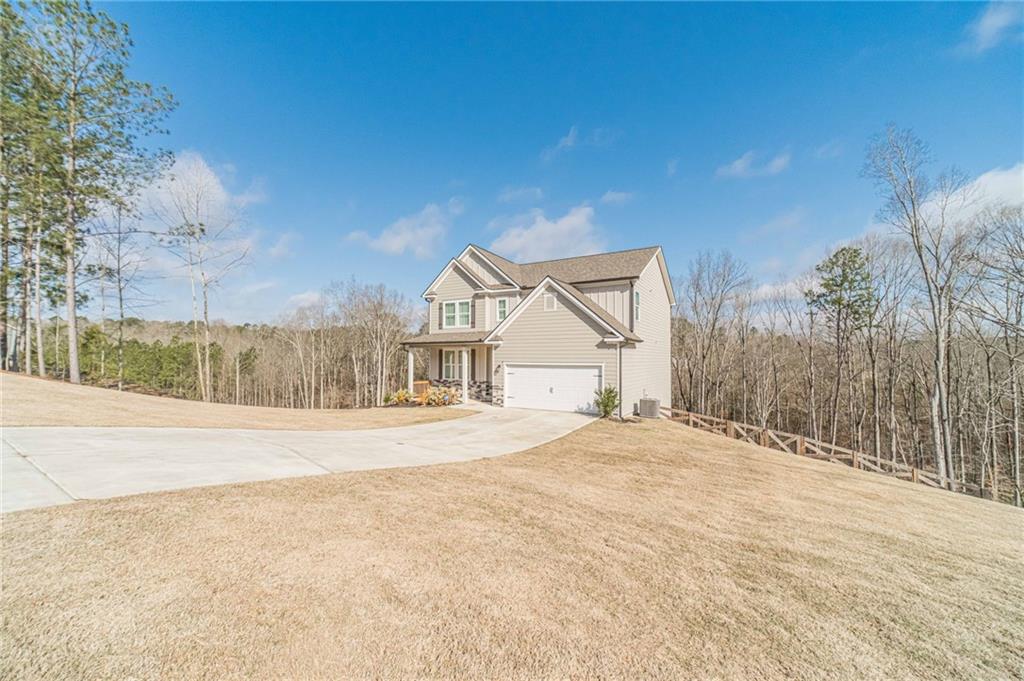1548 Ridgewood Court Monroe, GA 30656 - Photo 51 of 59 a view of an house with backyard and road