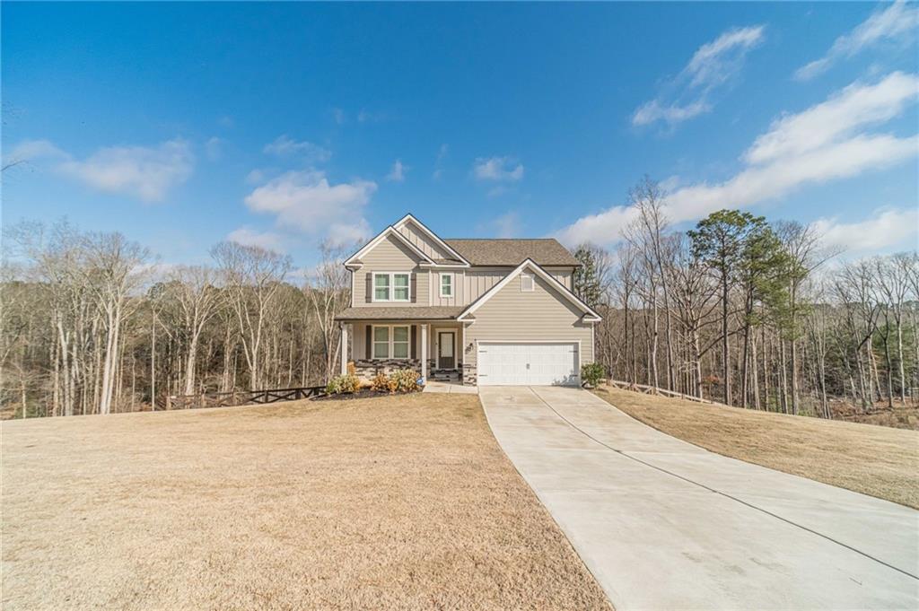 1548 Ridgewood Court Monroe, GA 30656 - Photo 52 of 59 a front view of a house with a yard