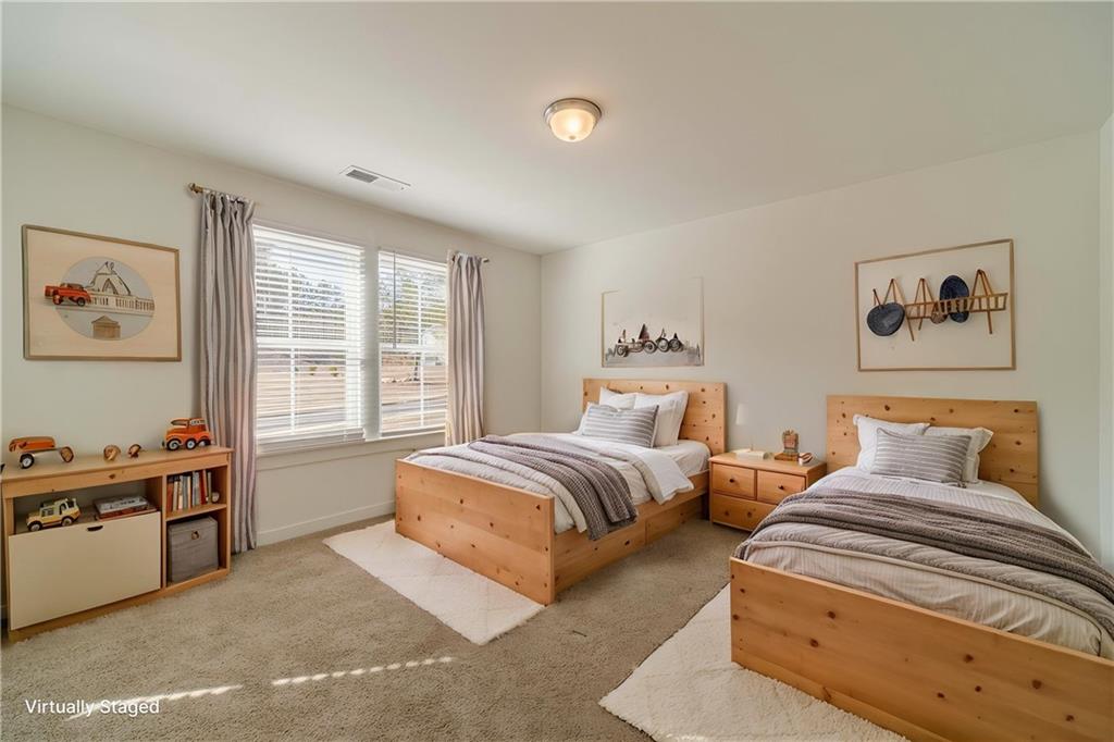 1548 Ridgewood Court Monroe, GA 30656 - Photo 8 of 63 a bedroom with two beds and a large window