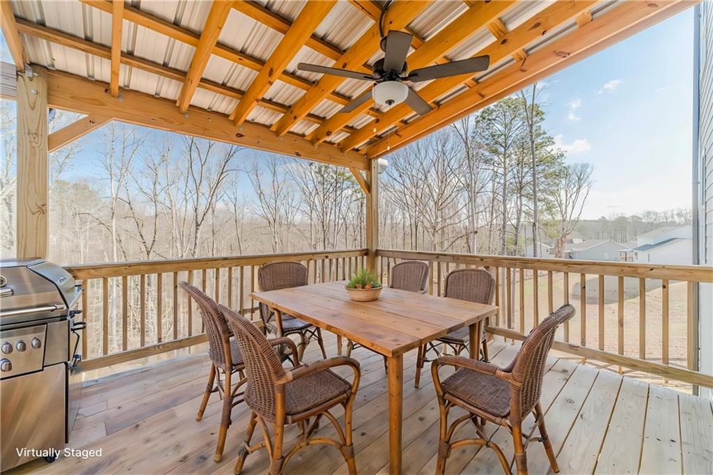 1548 Ridgewood Court Monroe, GA 30656 - Photo 10 of 63 a view of a chairs and table in the patio