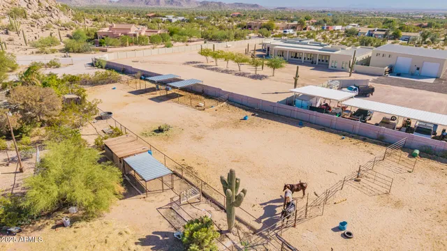 an aerial view of residential houses with outdoor space