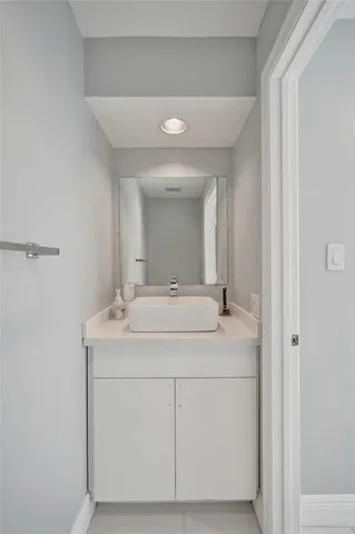 a bathroom with a sink and mirror