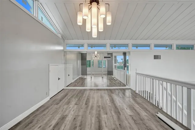 a view of gallery with wooden floor