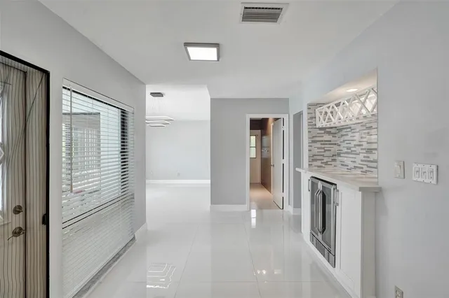 a view of a hallway with washer and dryer