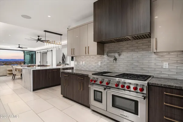 a view of a chairs and table on the wooden floor
