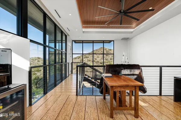a view of workspace with furniture and window