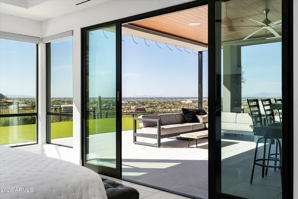 a bedroom with a bed and ceiling fan