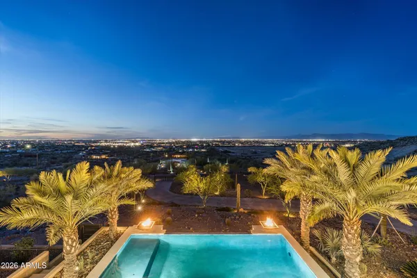 a view of a patio with couches and potted plants