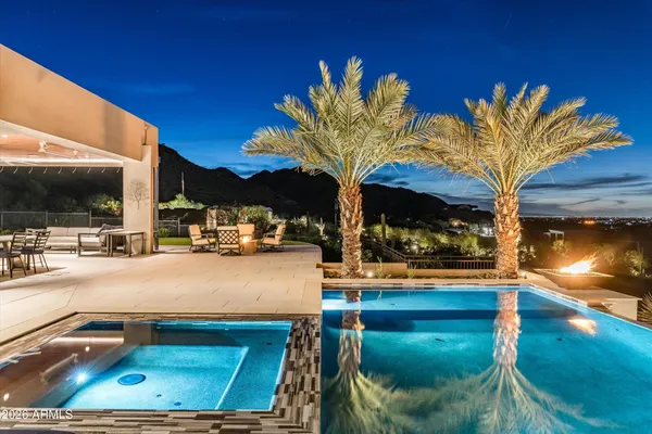a view of swimming pool with outdoor seating and a terrace