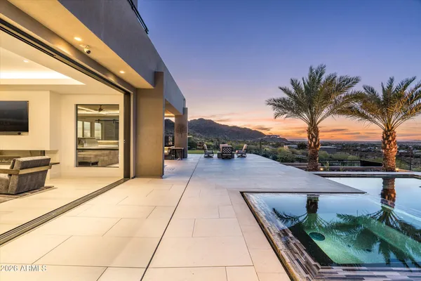 a view of a house with a large tree