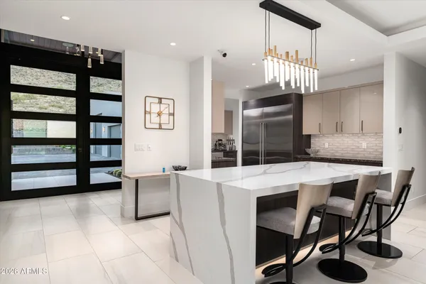 a kitchen that has a stove and a sink