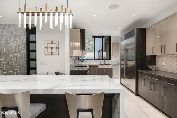 a kitchen with a stove a sink and a microwave