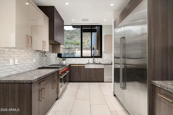 a kitchen with a stove and a refrigerator