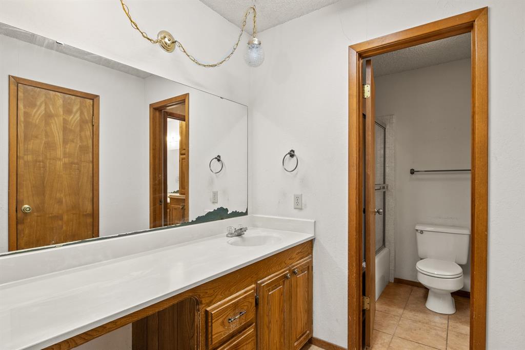 7777 Farm To Market 1001 Cookville, TX 75558 - Photo 16 of 30 a bathroom with a sink a toilet and shower