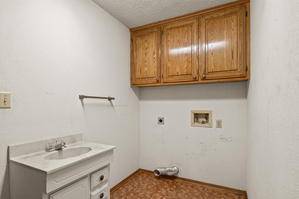7777 Farm To Market 1001 Cookville, TX 75558 - Photo 23 of 30 a bathroom with a sink and a mirror