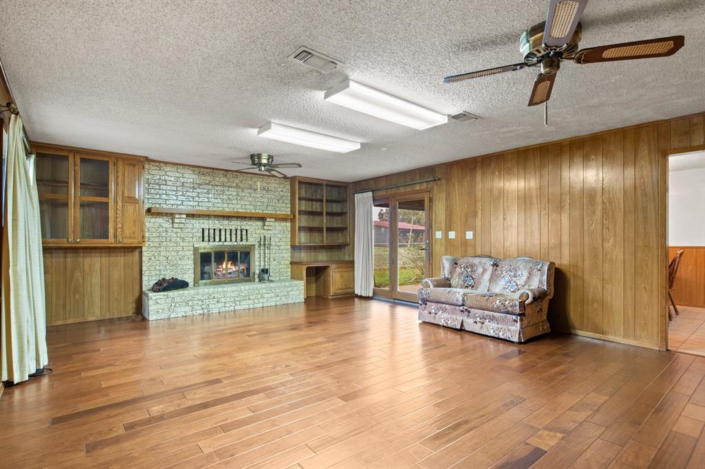 7777 Farm To Market 1001 Cookville, TX 75558 - Photo 6 of 30 a living room with furniture and a fireplace