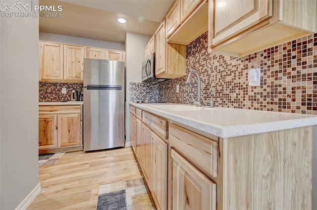 9470 Rockingham Drive Peyton, CO 80831 - Photo 27 of 39 kitchenette in light wood