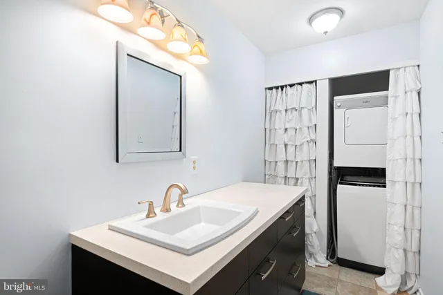 a kitchen with a sink cabinets and appliances