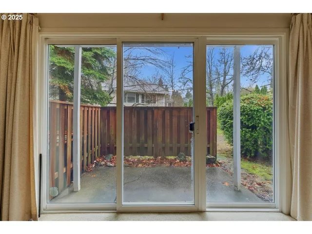 a view of a living room filled with furniture