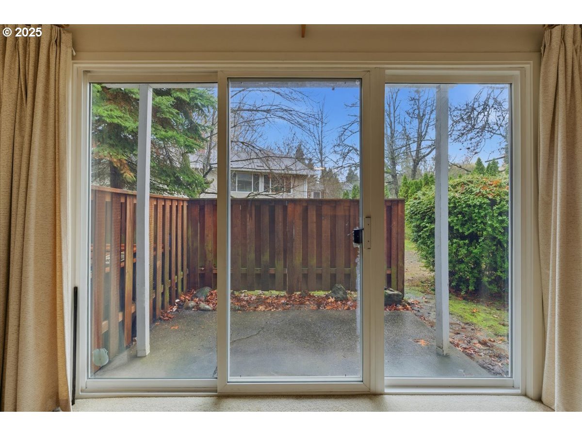 6835 Southwest Capitol Hill Road, Unit 30 Portland, OR 97219 - Photo 16 of 33 a view of a living room filled with furniture