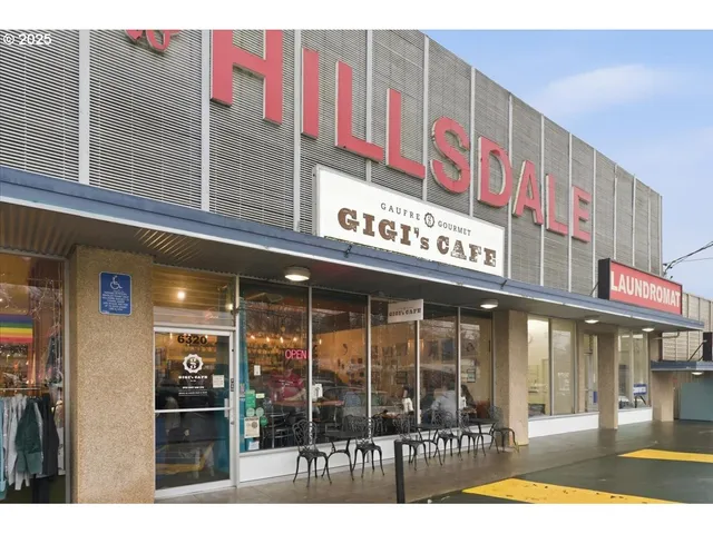 a view of a building with retail shops