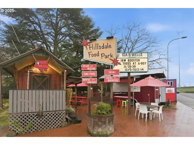 a outdoor seating area with furniture and wooden floor