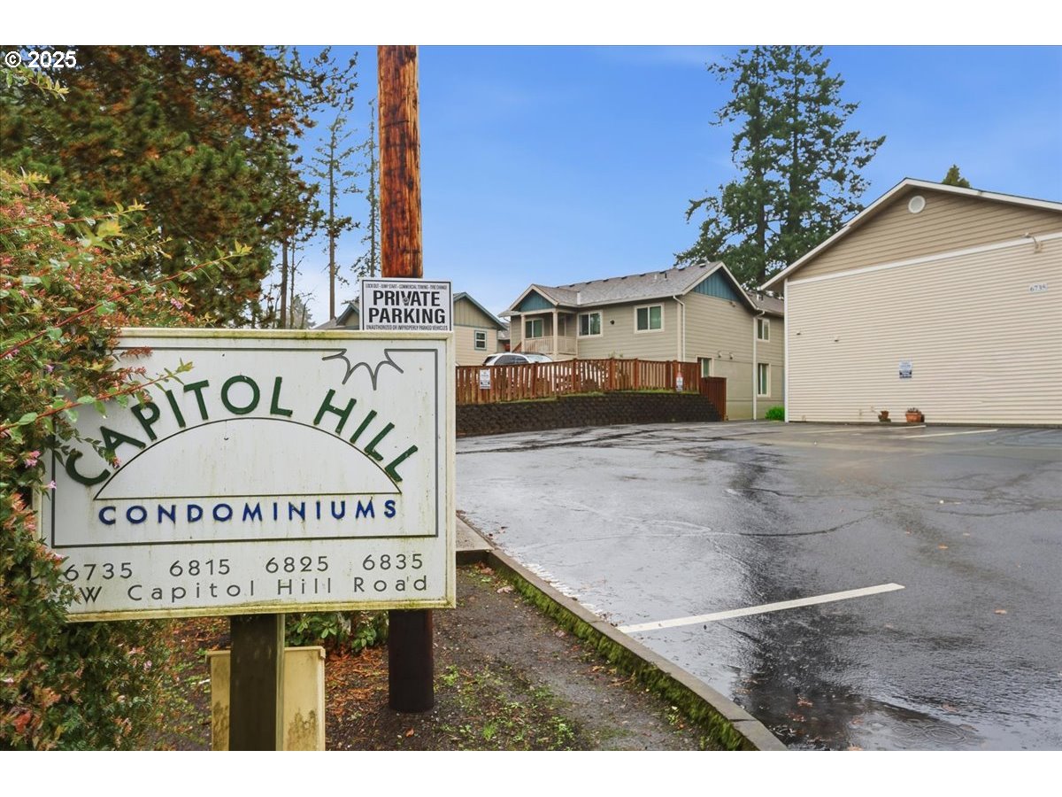 6835 Southwest Capitol Hill Road, Unit 30 Portland, OR 97219 - Photo 8 of 33 a view of a sign in front of building
