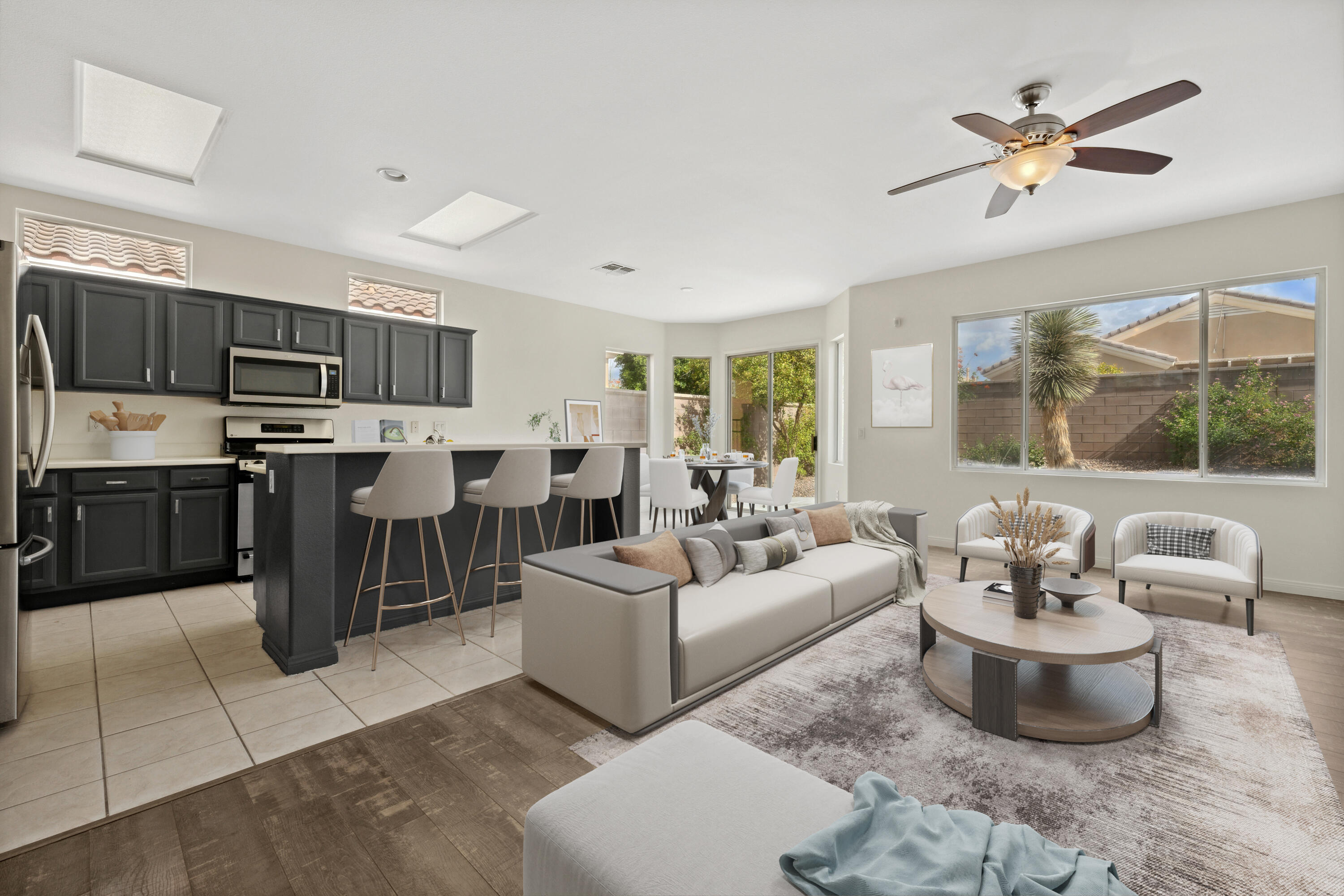 78640 Rainswept Way Palm Desert, CA 92211 - Photo 13 of 37 a living room with furniture kitchen view and a large window