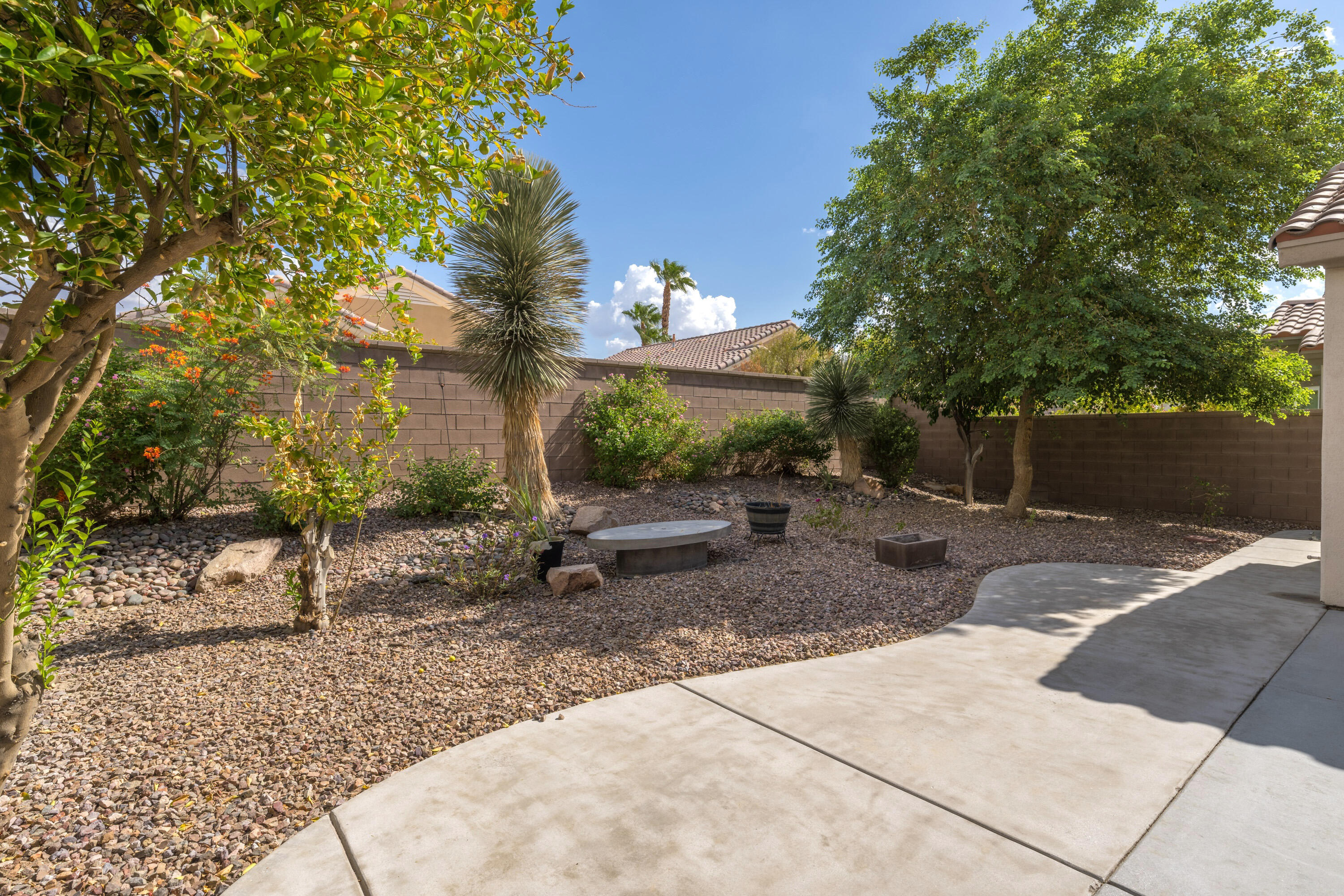 78640 Rainswept Way Palm Desert, CA 92211 - Photo 3 of 37 a view of a backyard with large trees