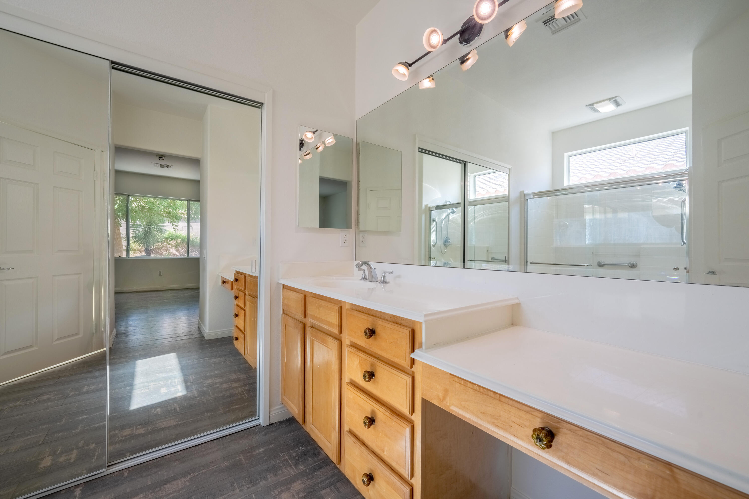 78640 Rainswept Way Palm Desert, CA 92211 - Photo 33 of 37 a spacious bathroom with a shower a sink and a large mirror