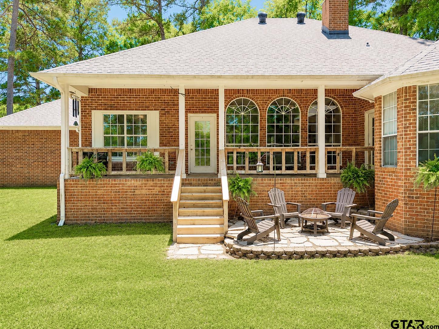1388 Santa Fe Trail Tyler, TX 75703 - Photo 44 of 46 a front view of a house with a yard table and chairs