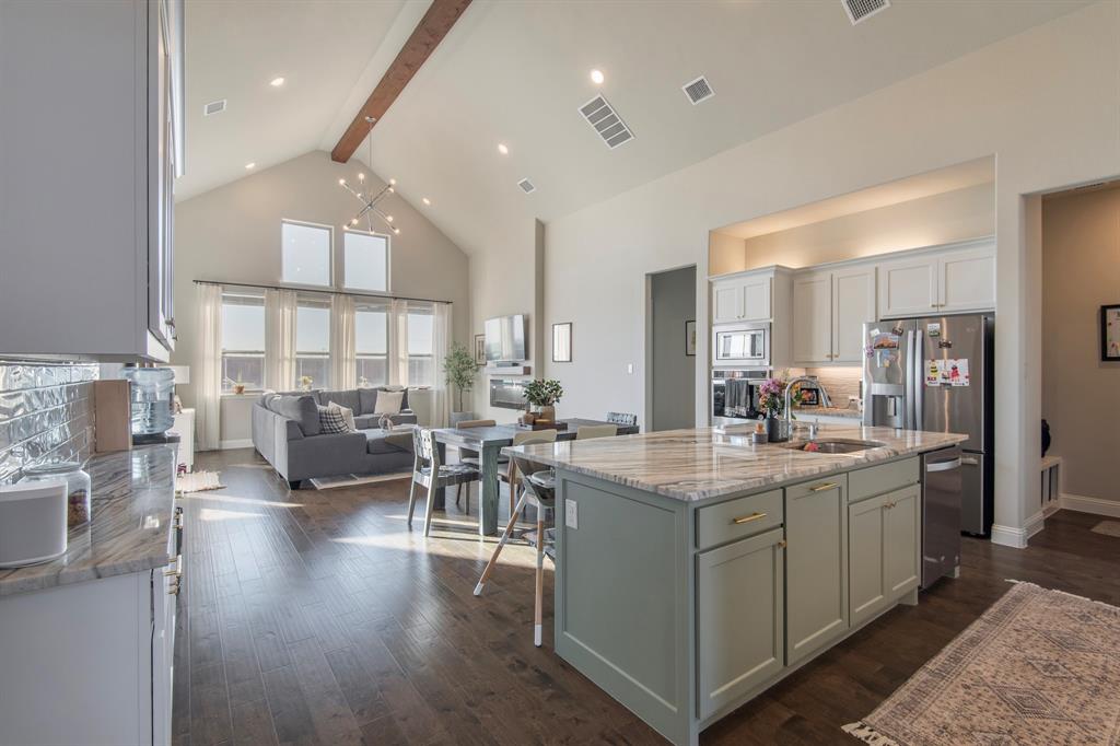 16650 Nightshade Road Frisco, TX 75033 - Photo 3 of 40 a view of a kitchen and dining room