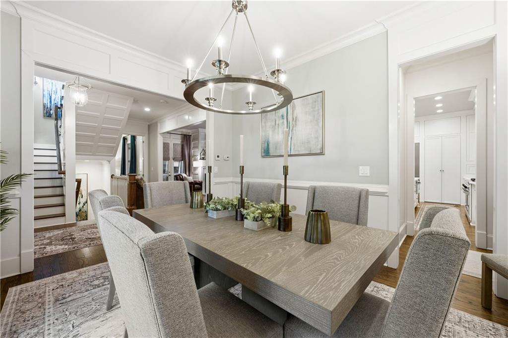 1295 Cumberland Road Northeast Atlanta, GA 30306 - Photo 13 of 71 a dining room with furniture and a chandelier