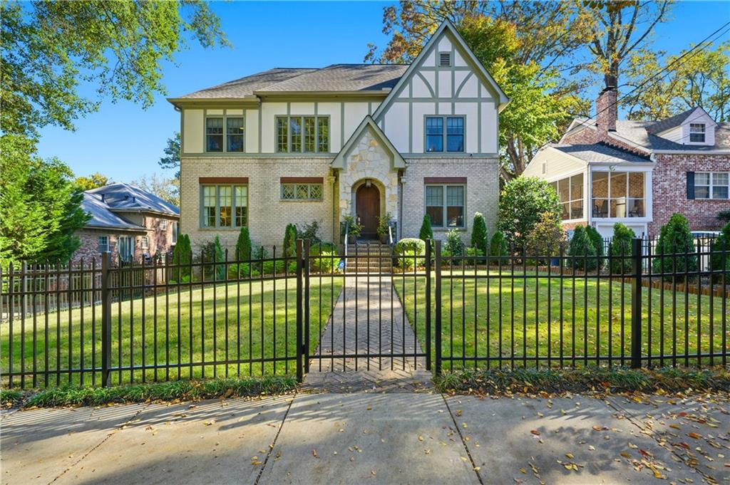 1295 Cumberland Road Northeast Atlanta, GA 30306 - Photo 2 of 71 a front view of a house with a garden