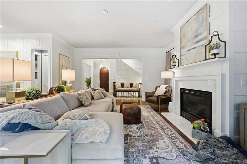 1295 Cumberland Road Northeast Atlanta, GA 30306 - Photo 24 of 71 a living room with furniture and a fireplace