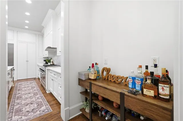a living room with furniture kitchen view and a table