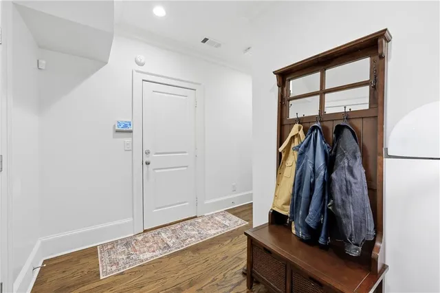 a spacious bathroom with a double vanity sink a mirror and shower
