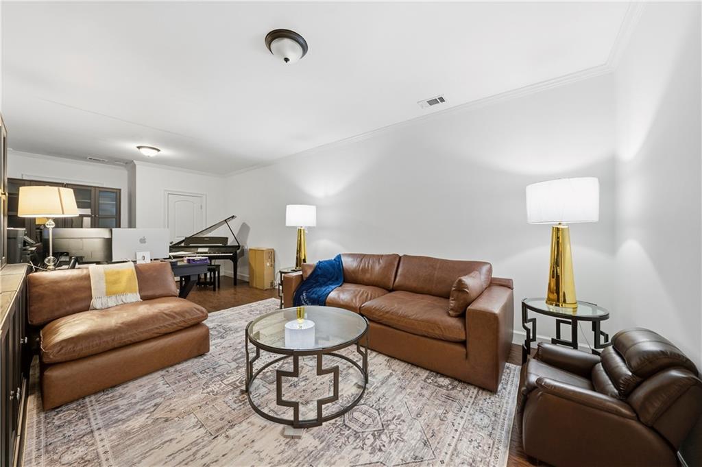 1295 Cumberland Road Northeast Atlanta, GA 30306 - Photo 43 of 71 a living room with furniture kitchen view and a table