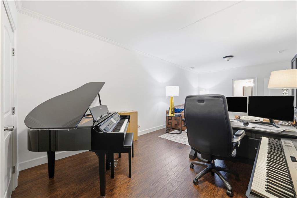 1295 Cumberland Road Northeast Atlanta, GA 30306 - Photo 44 of 71 a view of a workspace with furniture and wooden floor