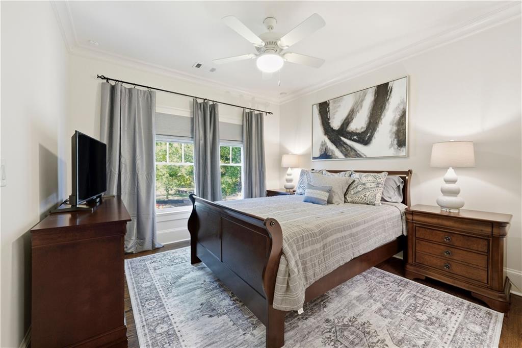 1295 Cumberland Road Northeast Atlanta, GA 30306 - Photo 55 of 71 a bedroom with a bed and a flat screen tv