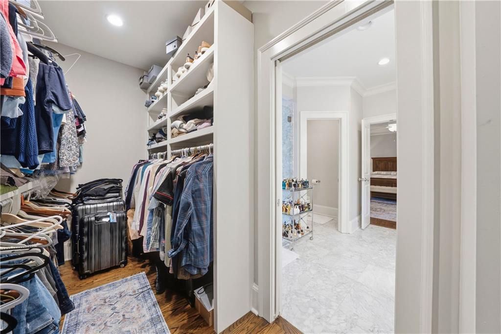 1295 Cumberland Road Northeast Atlanta, GA 30306 - Photo 59 of 71 a view of walk in closet with clothes and shoes